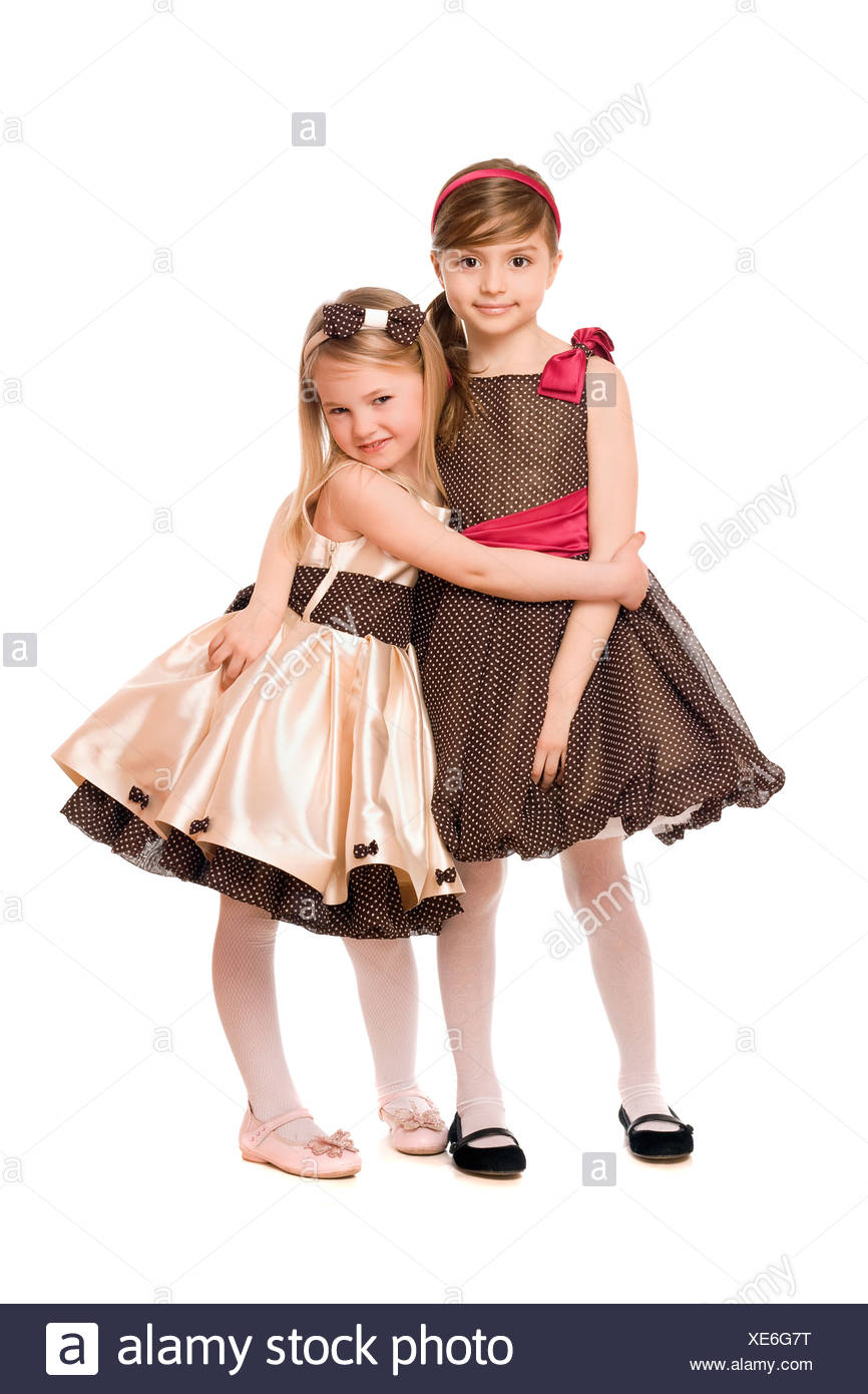 Two Cute Little Girls In A Dress Isolated Stock Photo Alamy