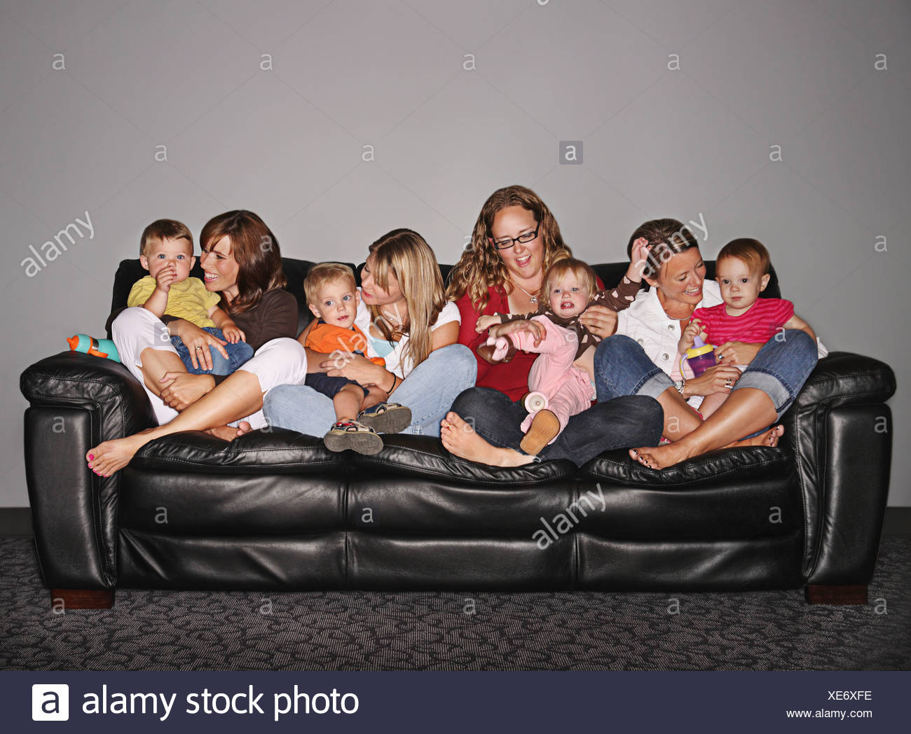 Four Mothers And Their Children On A Couch Edmonton Alberta