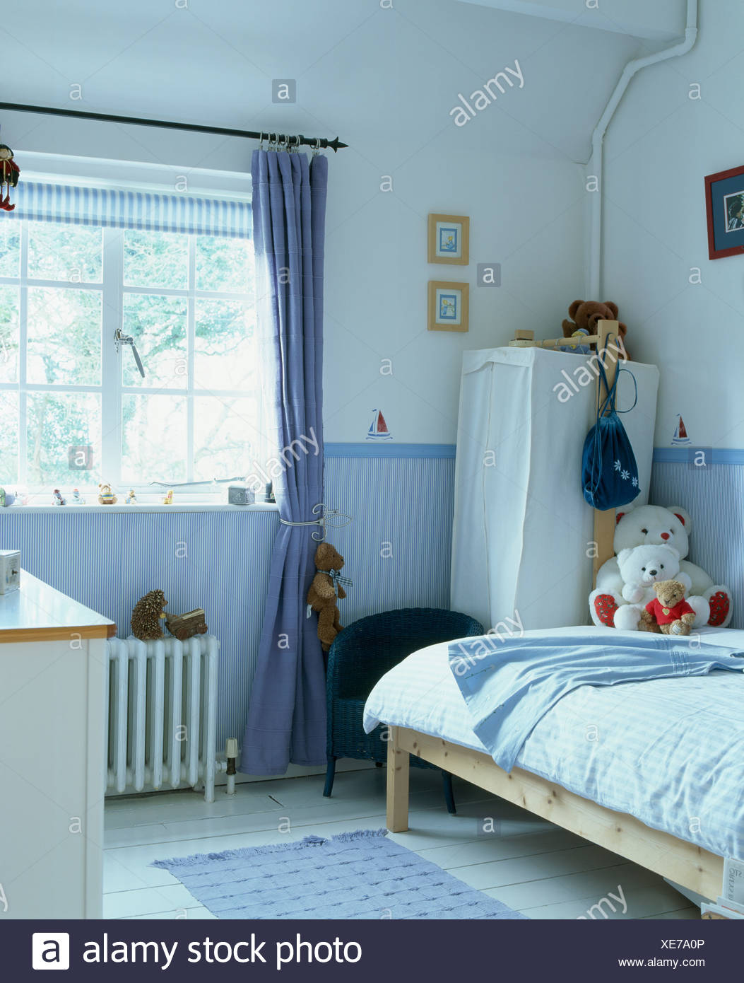 Blue Curtain At Window In Child S Bedroom With Blue Wallpaper Dado