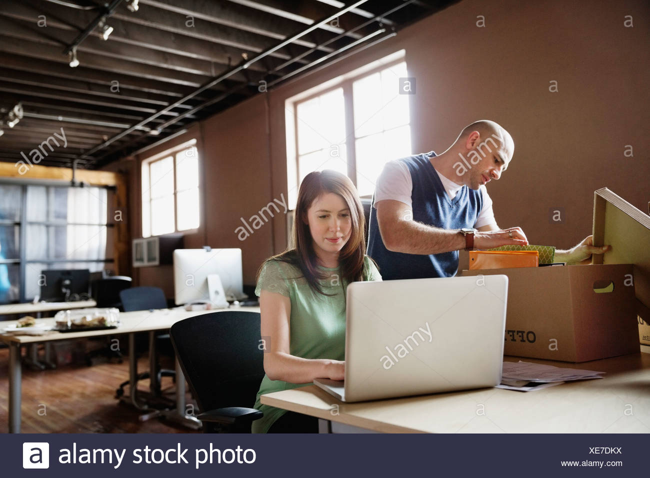 Entrepreneurs Moving Into Creative Office Space Stock Photo