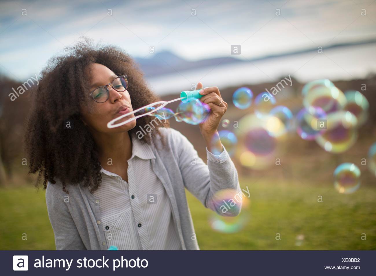 Woman Blowing Bubbles Images