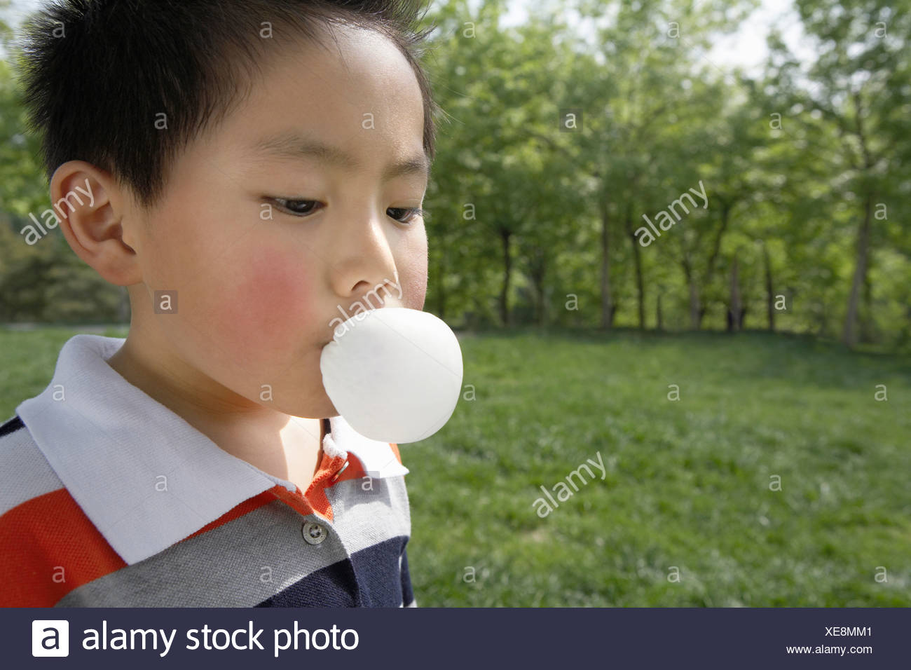 Young Boy Blowing Chewing Gum Stock Photos & Young Boy Blowing Chewing