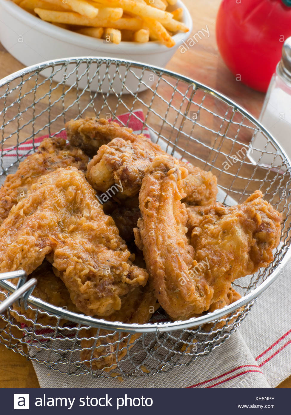 Southern Fried Chicken in a Basket with Fries Stock Photo - Alamy