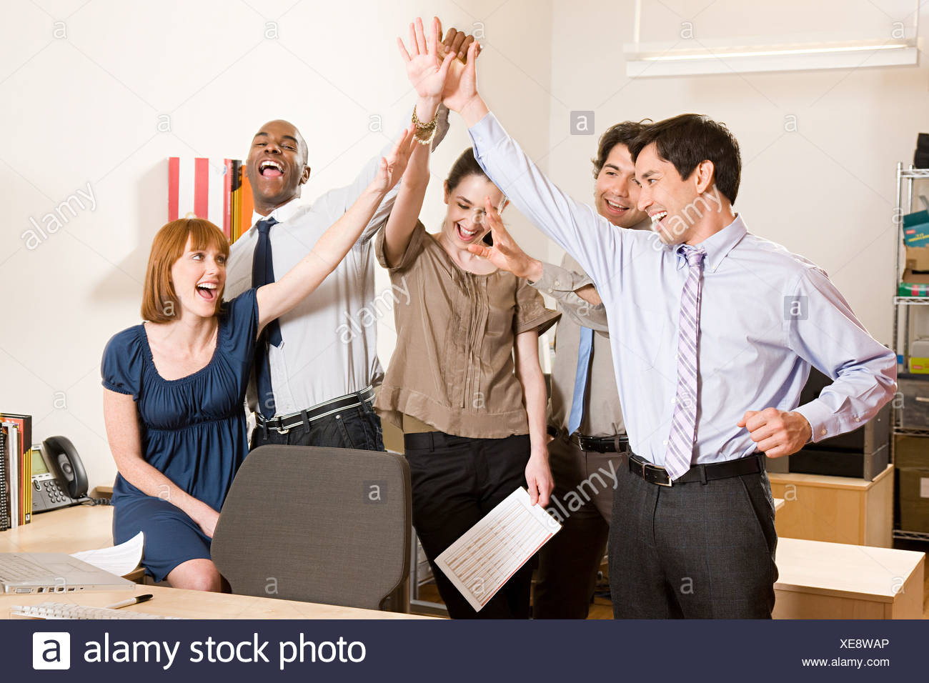 Office workers celebrating Stock Photo