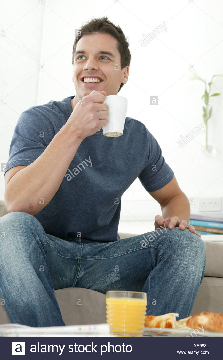 Male Short Dark Brown Hair Wearing Dark Grey T Shirt And