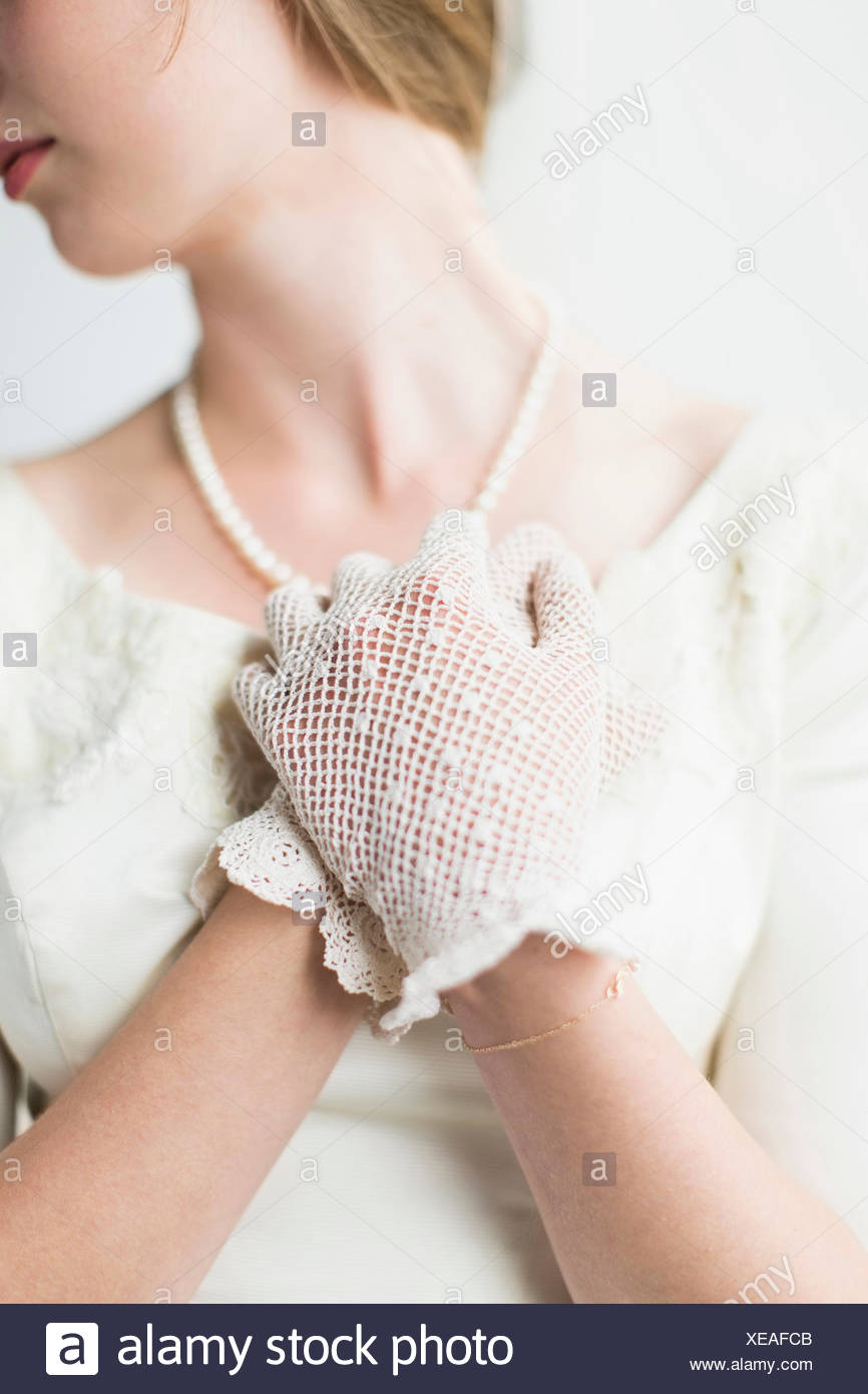 Mid section of bride wearing formal glove Stock Photo
