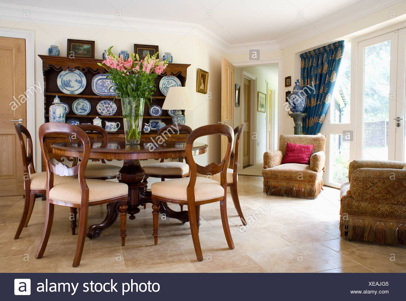 Antique Circular Table With Antique Balloon Back Chairs In Country