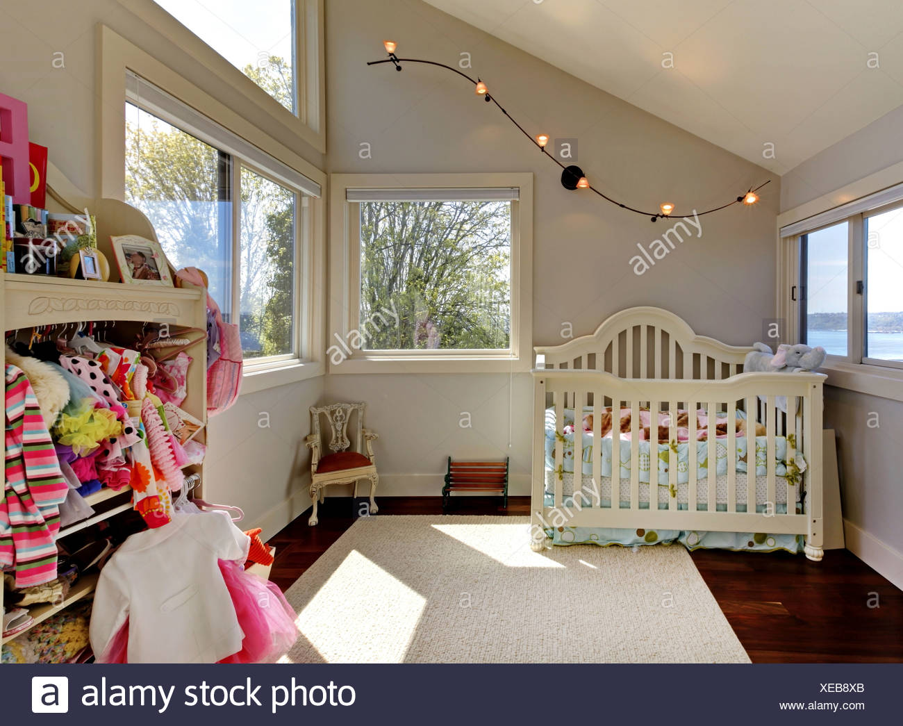 Baby Girl Room With White Crib And Clothes Stock Photo 284219555