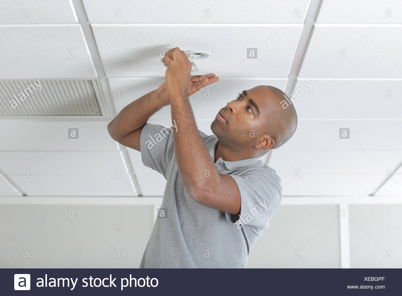 Man Fixing Ceiling Light Stock Photo 284225719 Alamy