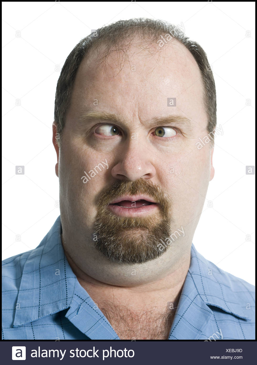 close-up-of-a-mature-man-looking-cross-eyed-XEBJ9D.jpg