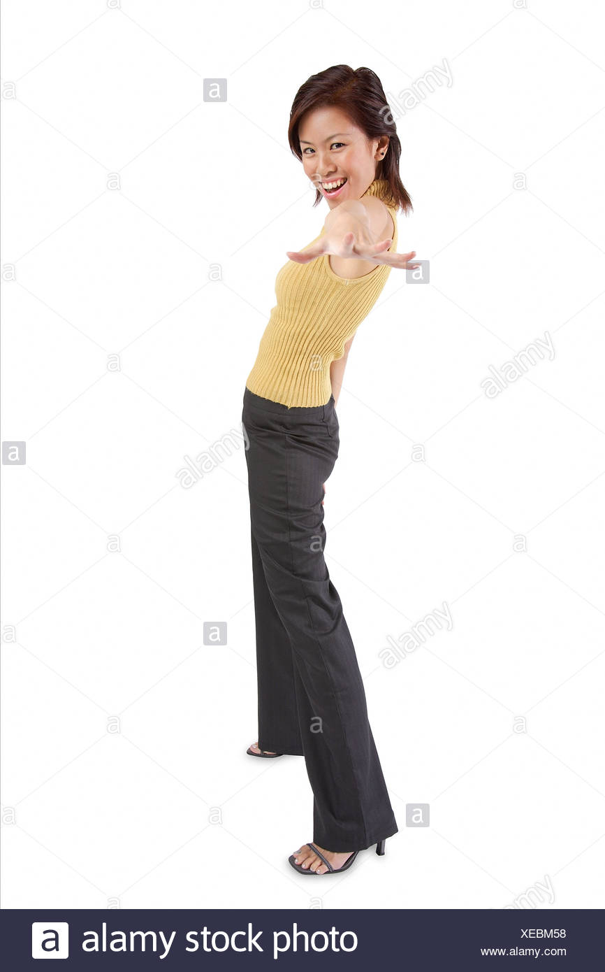 Young Woman Standing Hand Outstretched Towards Camera Stock Photo Alamy