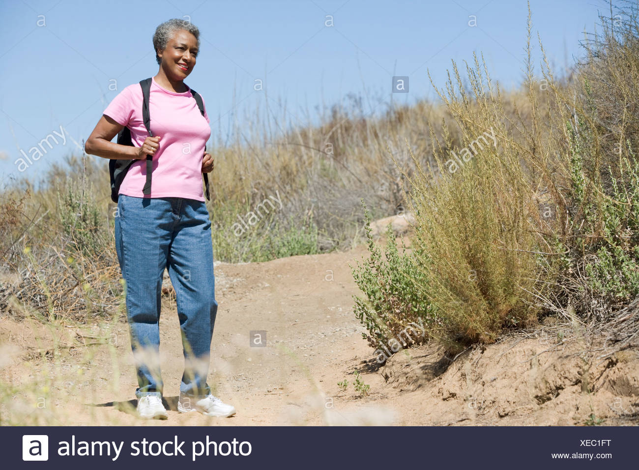 Mature Woman Hiking On Trail High Resolution Stock Photography and