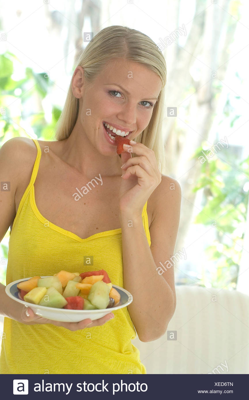 Blonde Female Long Straight Hair In A Side Parting Looking To