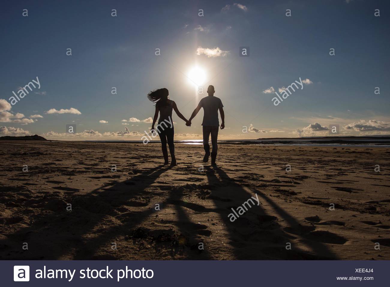 Silhouette Of Couple Walking High Resolution Stock Photography and ...