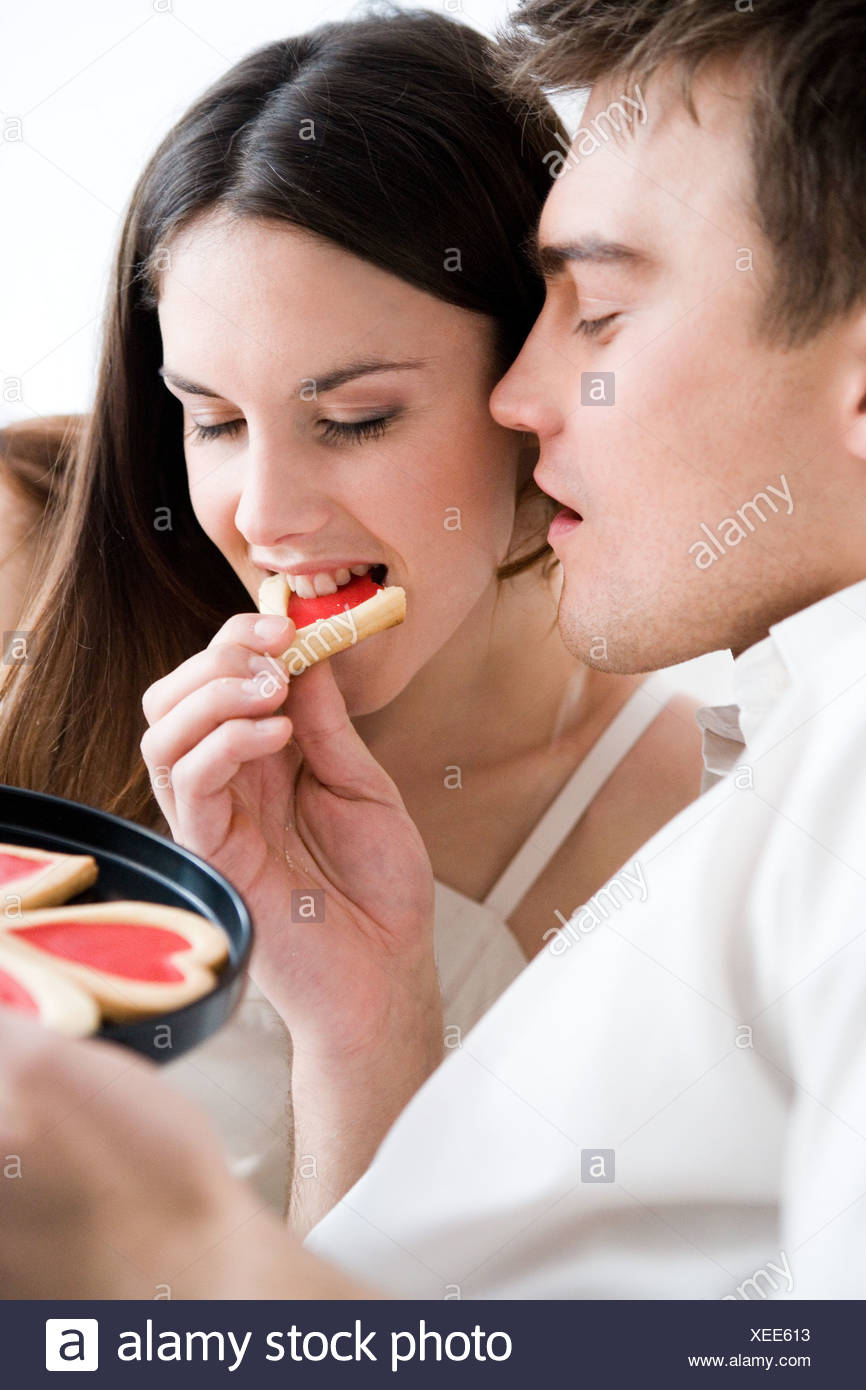 girl feeding boy