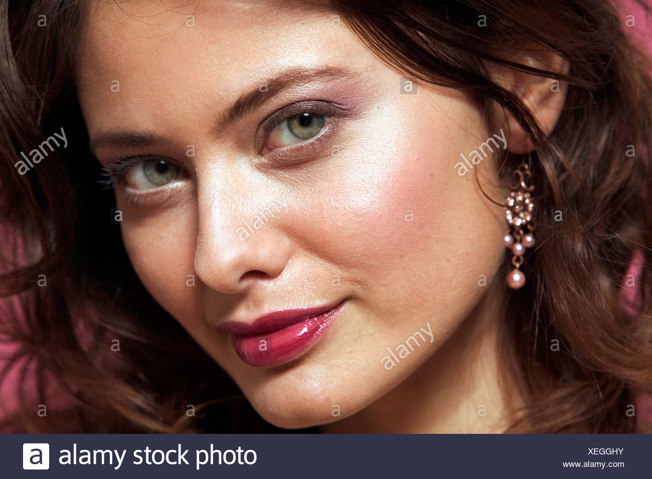 Female Curly Brunette Hair Purple Eyeshadow And Dark Red Lip