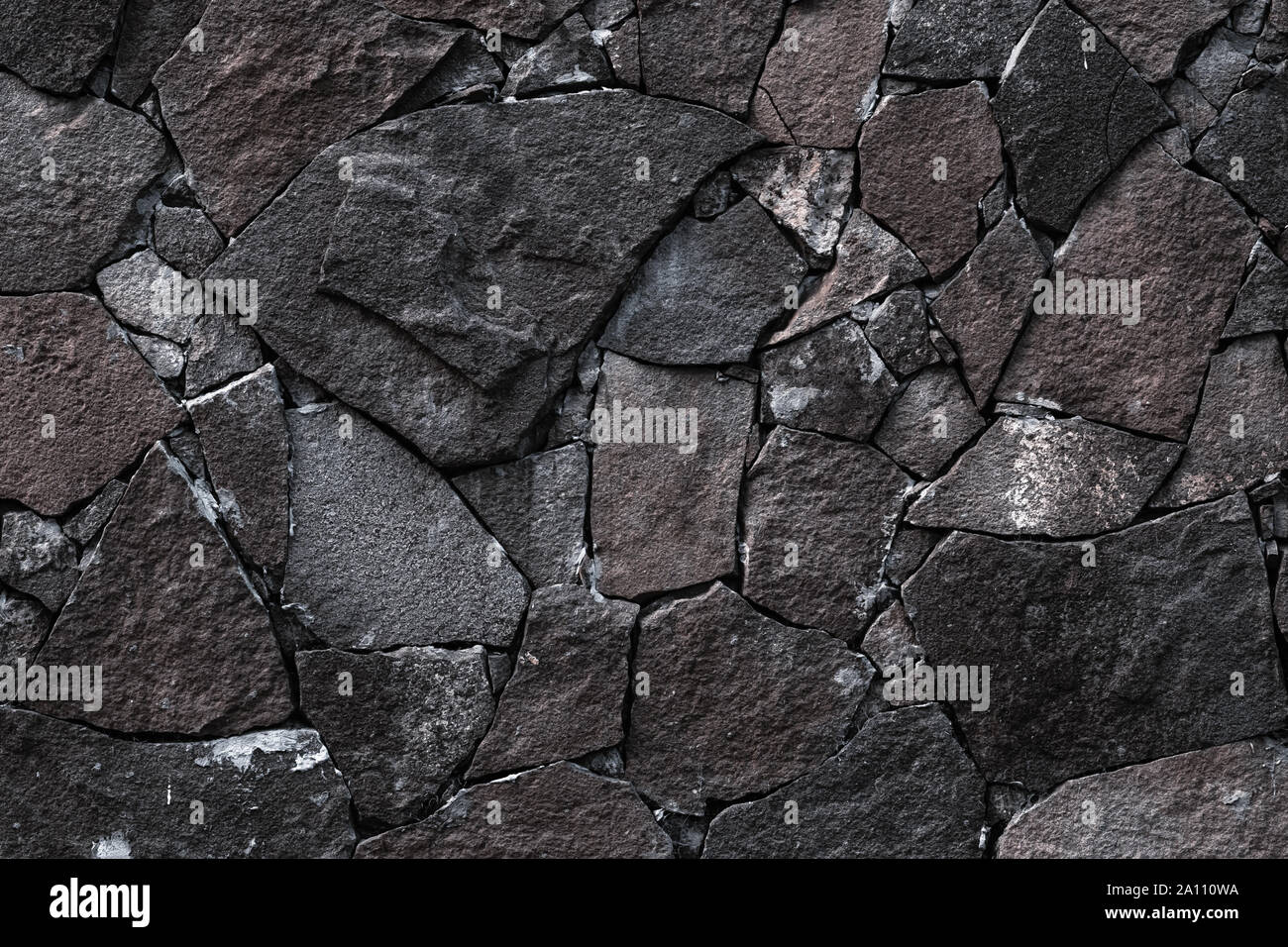 Dunklen stein Wand Hintergrund. Grauen Stein -Textur im Retro-Stil. Brick Wall Hintergründe. Abstrakte Muster. Grauen Steinen, strukturierte Oberfläche, natürliche backdro Stockfoto