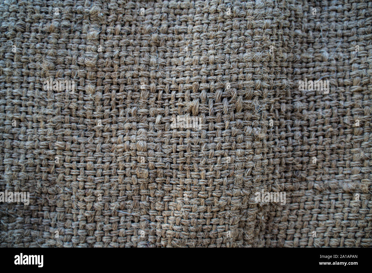 Hessische Sack gewebter Textur muster Hintergrund in hellem Creme Gelb Beige Farbe Stockfoto