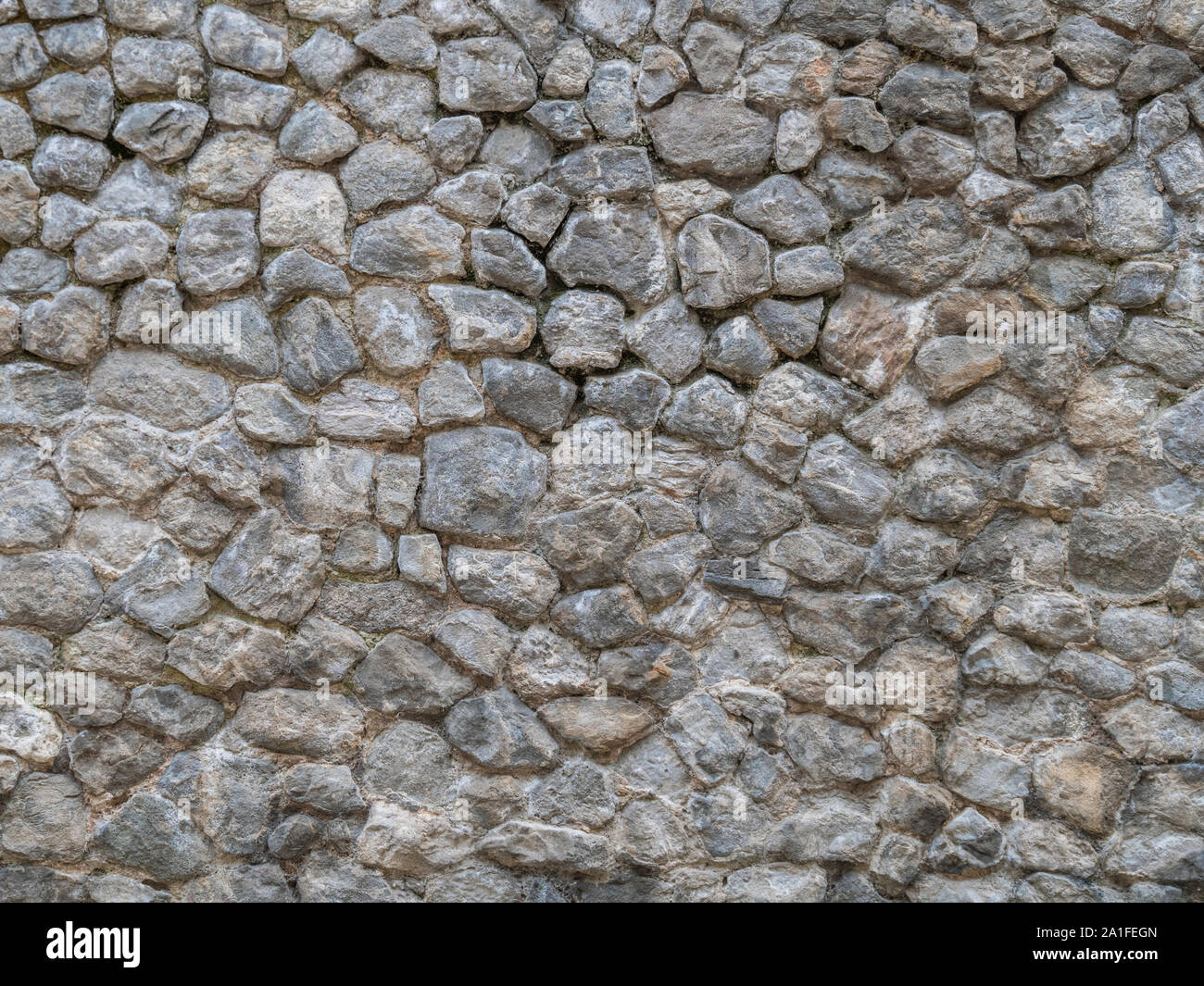 Natursteinmauer Textur. Stockfoto
