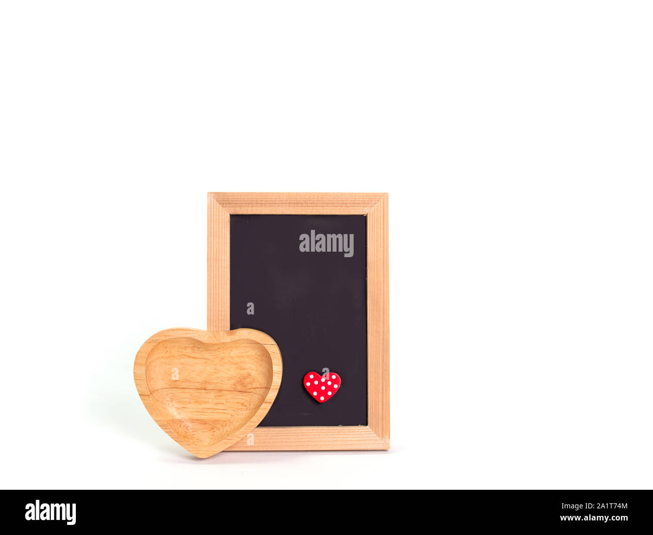 Bilderrahmen Holz, Holz Herzen nebeneinander gestellt. Stockfoto