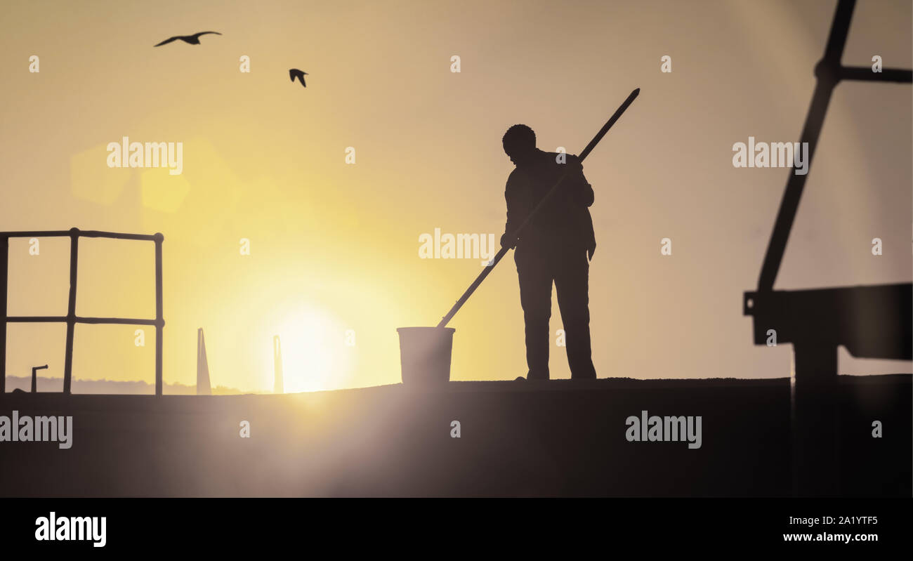 Afrikanische Arbeiter, Motswana Mann aus Botswana in den frühen Morgenstunden arbeiten. Stockfoto