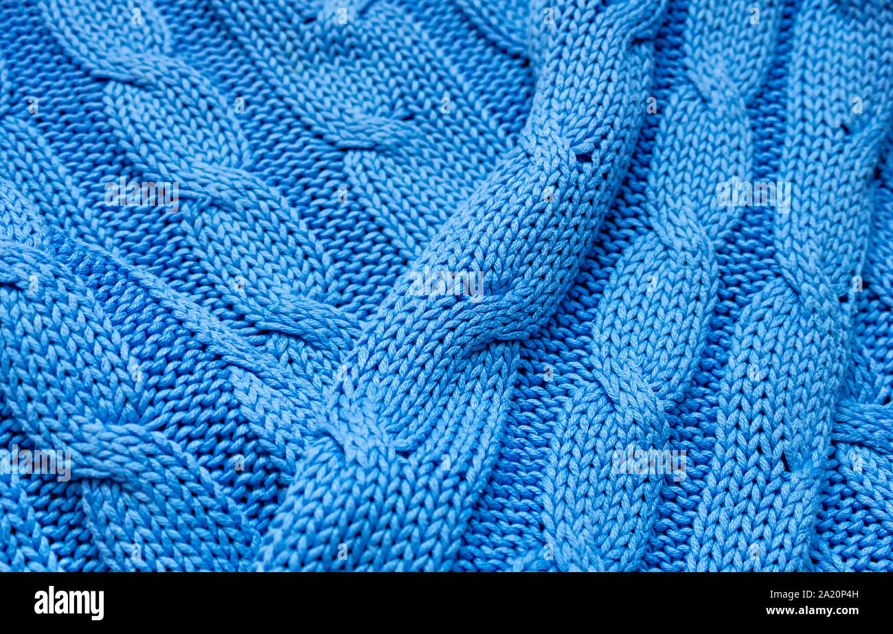 Gestrickte Textur in Blau. Hintergrund für einen Urlaub. Close Up. Stockfoto