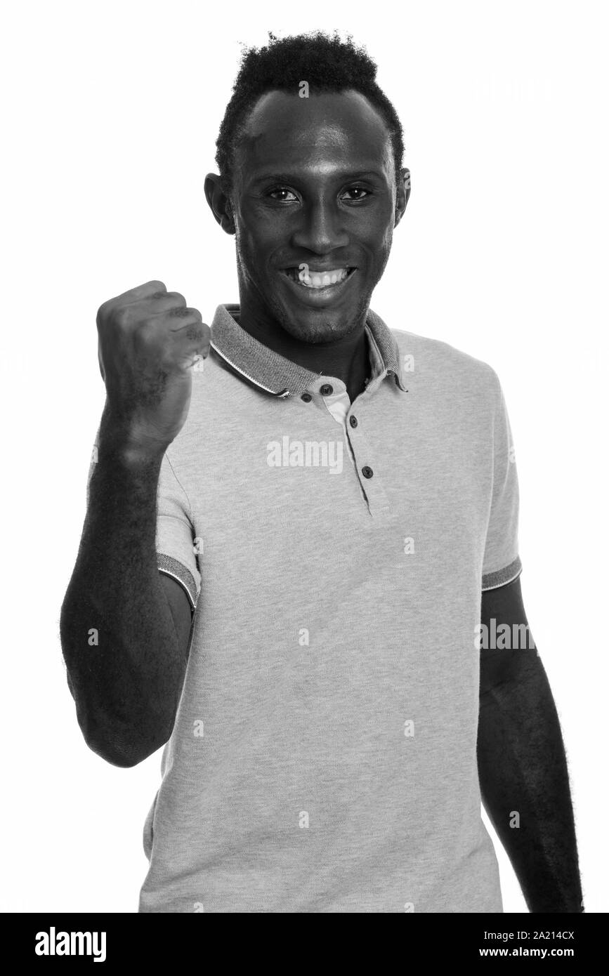 Junge glücklich afrikanischer Mann lächelnd und suchen motivierte Stockfoto