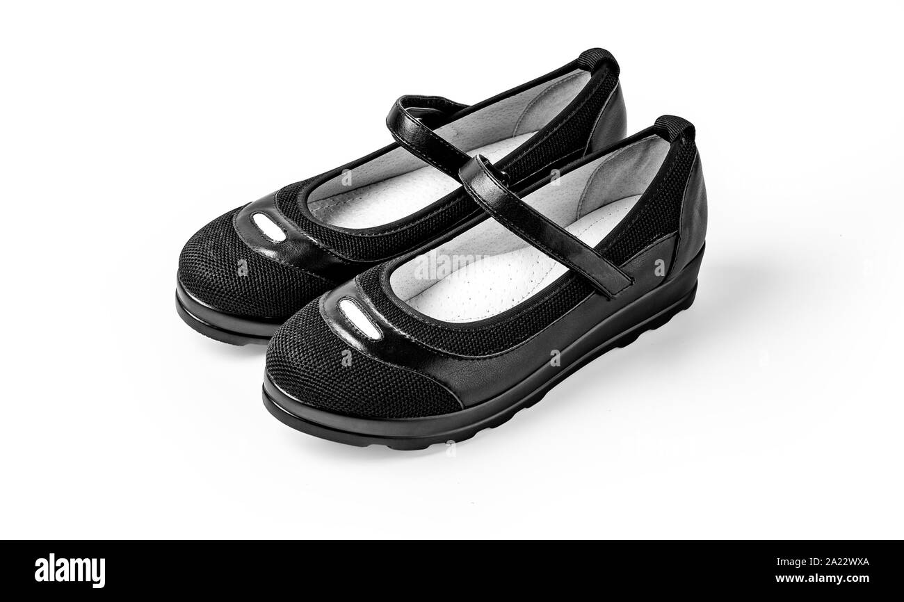 Schwarze Mädchen Schuhe auf Weiß mit Freistellungspfad isoliert Stockfoto