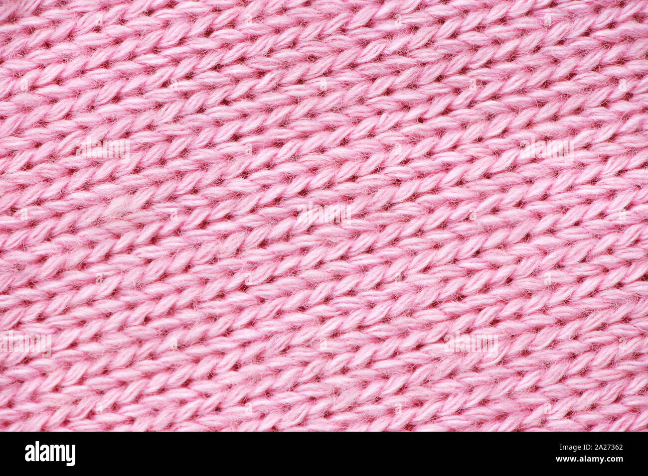 Rosa Stricken Pullover Muster Nahaufnahme. Weich und süß Konzept. Stockfoto
