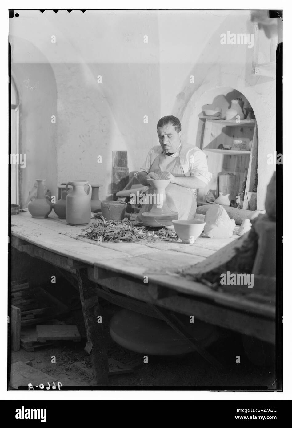 Potter auf seiner Drehbank Rad Stockfoto