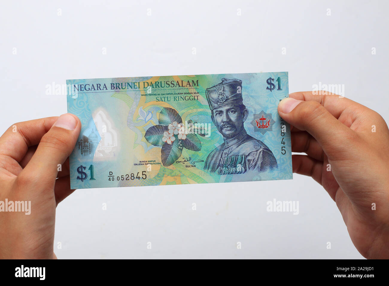 Brunei Währung gegen den weißen Hintergrund Stockfoto
