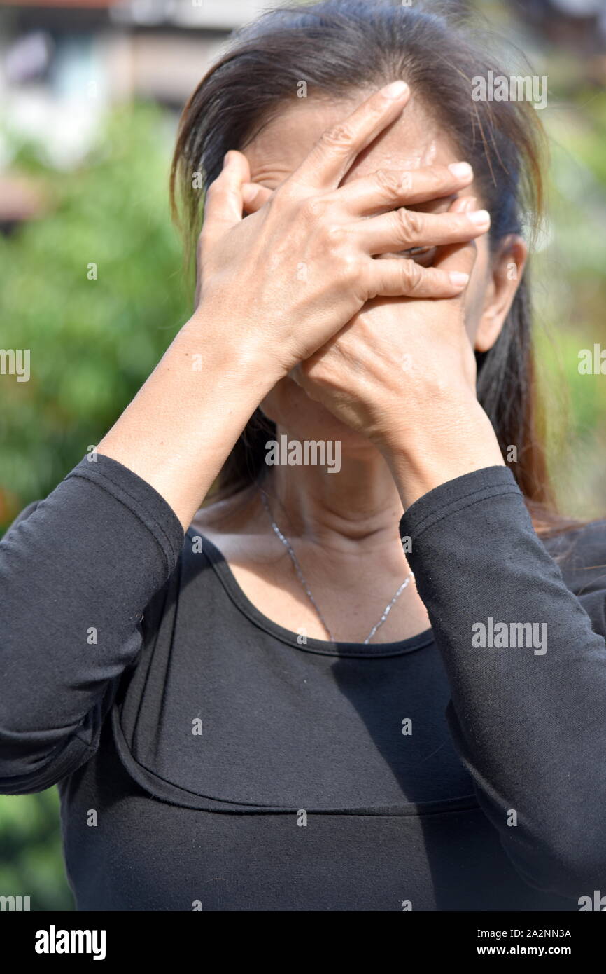 Eine beschämende Alte Filipina Person Stockfoto