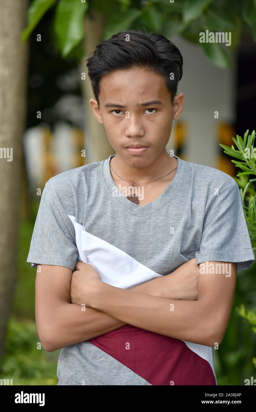 Ein störrischer Jugendlicher asiatischen Teenager Boy Stockfoto