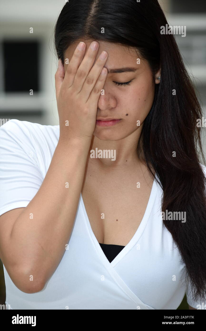 Eine beschämende asiatische Frau Stockfoto