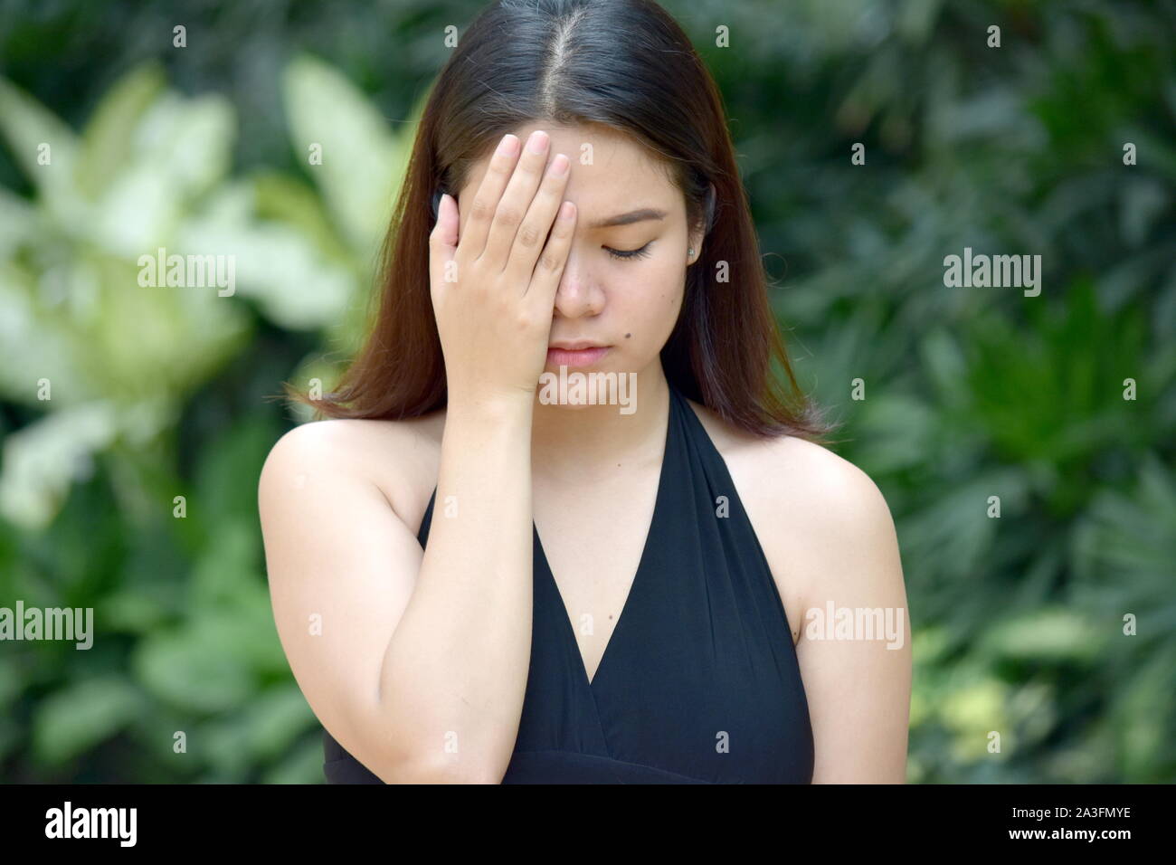 Eine attraktive Filipina Weibliche und Enttäuschung Stockfoto