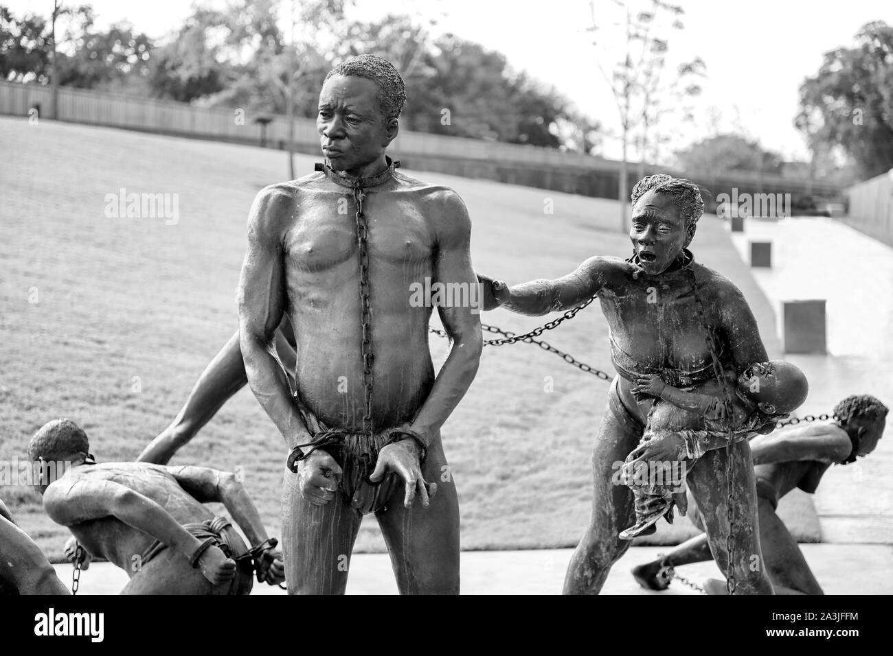 Eine Skulptur, eine Familie von schwarzen Sklaven. Den schwarzen Stecker erscheint hilflos, während seine Frau und Kind zu ihm Hilferufe Stockfoto