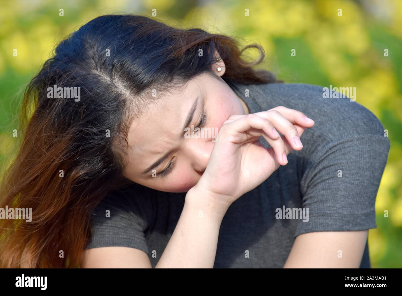 Tearful junge Filipina Weiblich Stockfoto