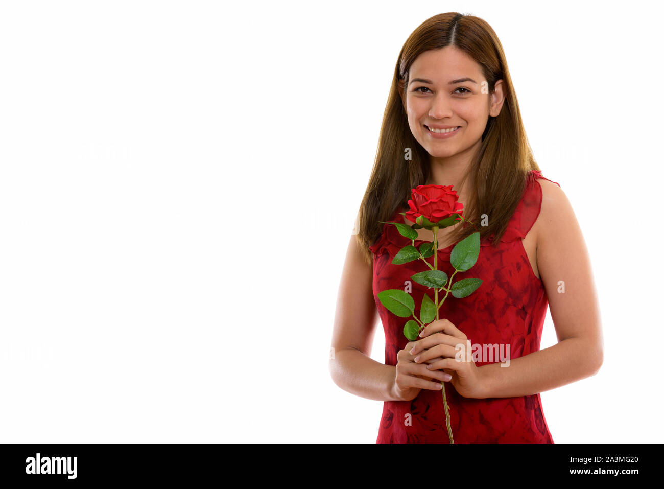 Studio shot Der glückliche junge schöne Frau und lächelnd r Stockfoto
