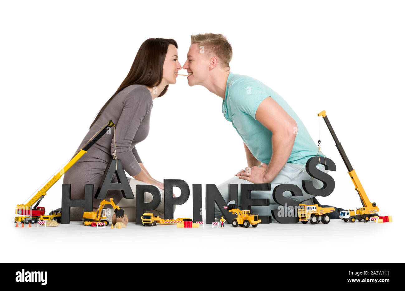 Verspielt junges Paar mit Wort Glück. Stockfoto