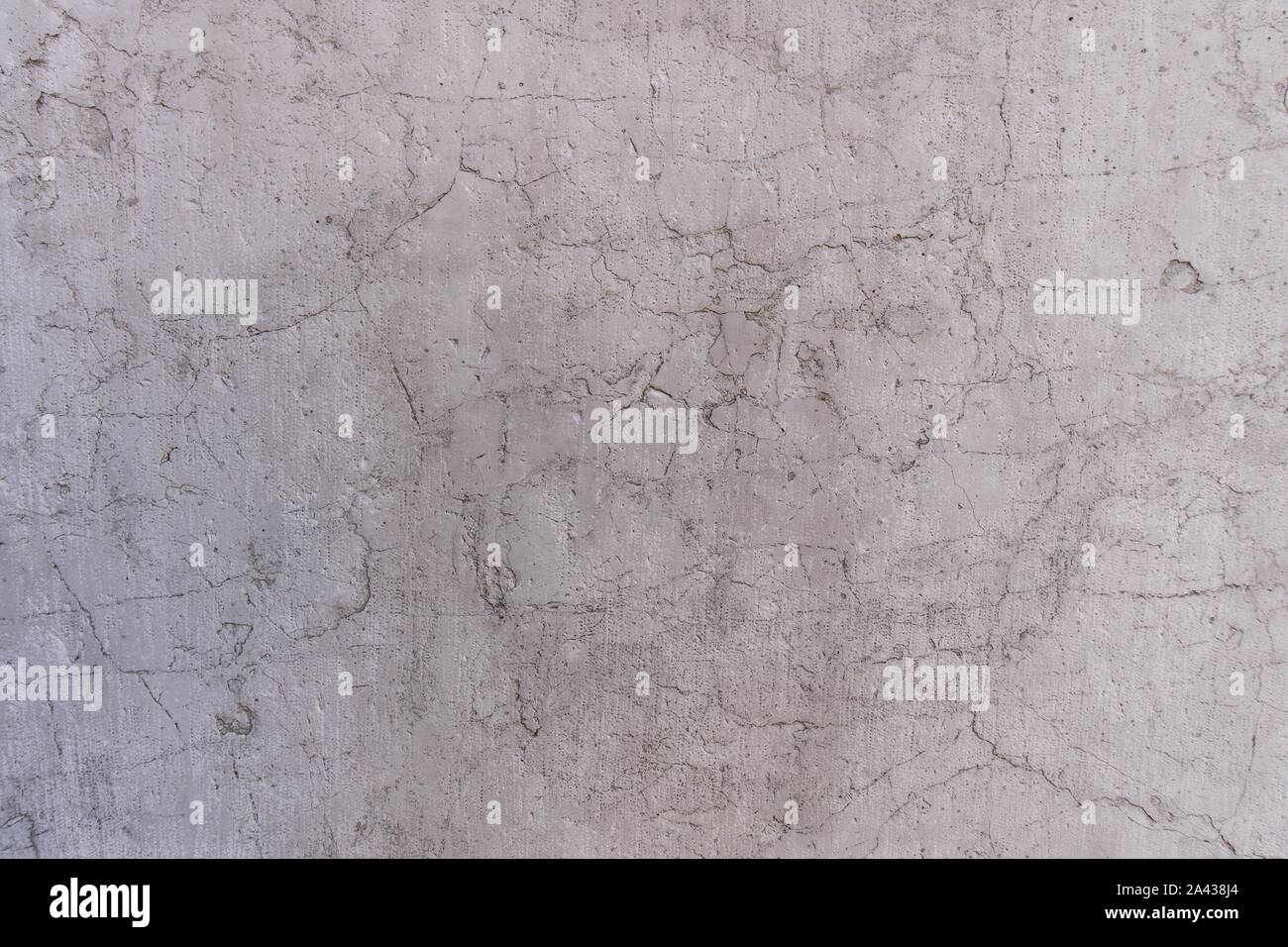 Grauer Marmor Wand mit zufälligen dünne Risse Stockfoto