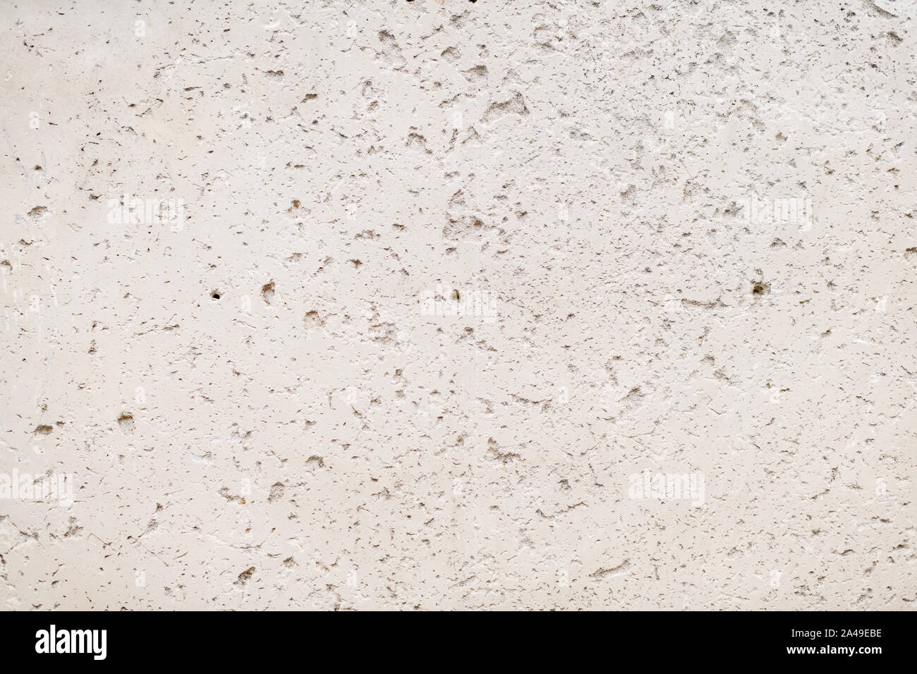 Grobe material Zement Wandfläche mit natürlichen Risse und Löcher Stockfoto