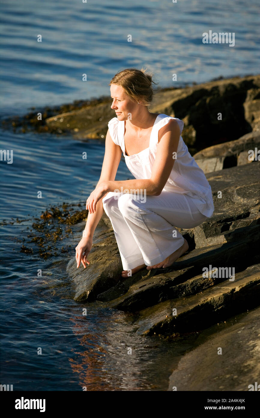 Frau am Meer Stockfoto