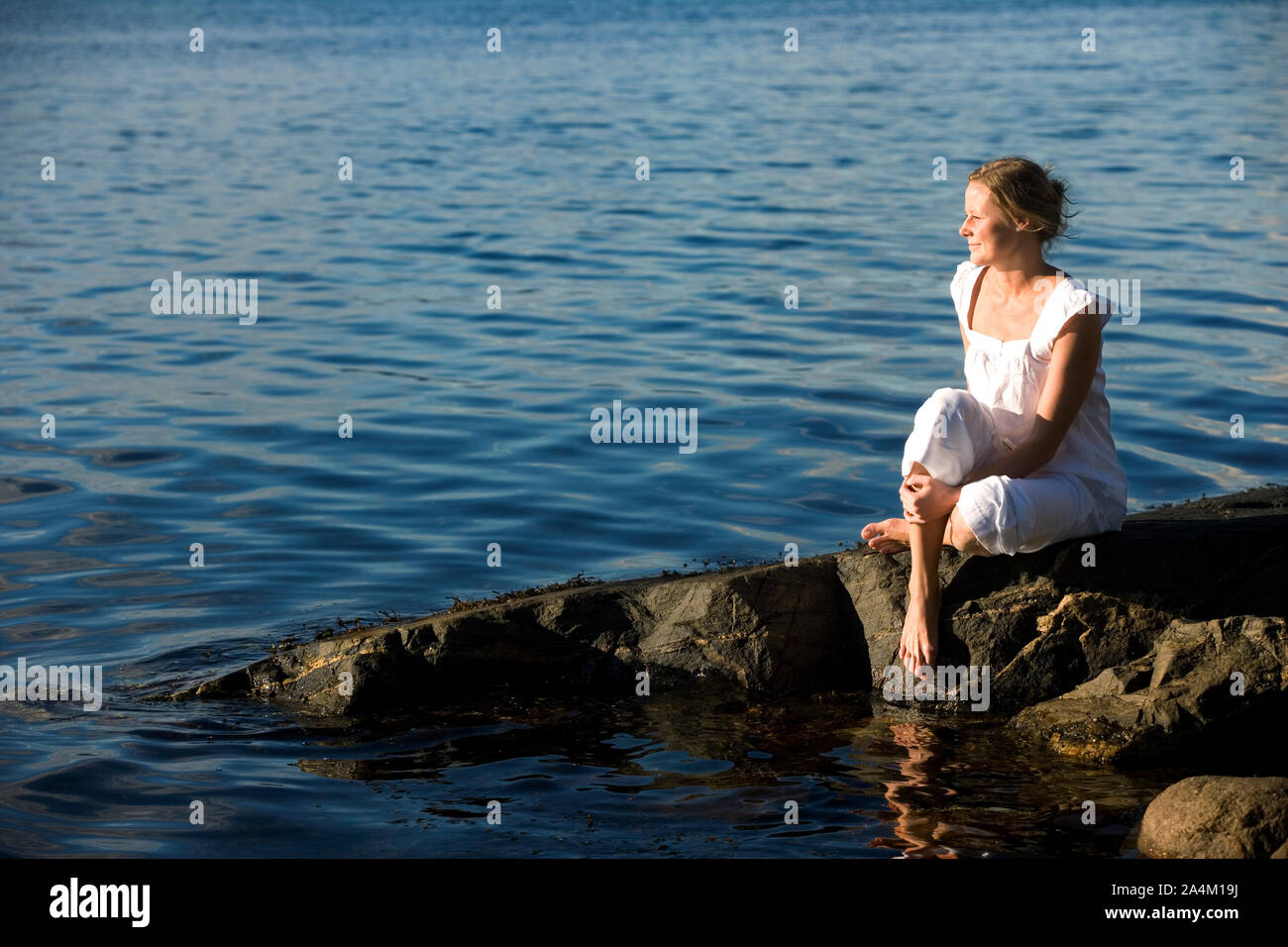 Frau am Meer Stockfoto