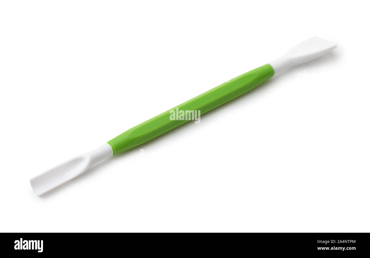 Grün Kunststoff doppelseitige Modeling Tool isoliert auf weißem Stockfoto