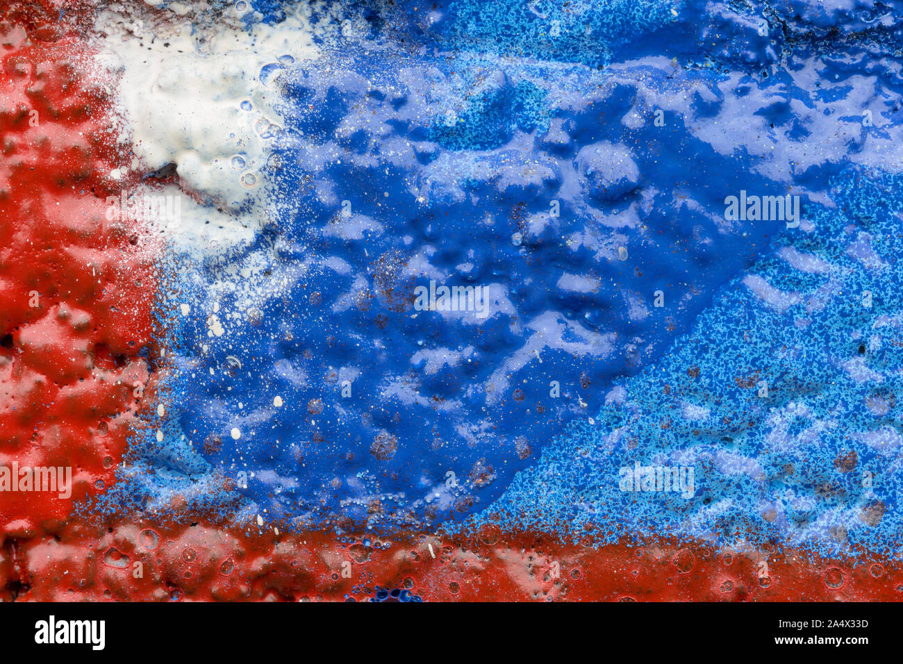 Makro Nahaufnahme von bunten Lacksprays und Spritzer auf einer unebenen Wand. Hohe Auflösung abstract full frame strukturierten Hintergrund. Stockfoto