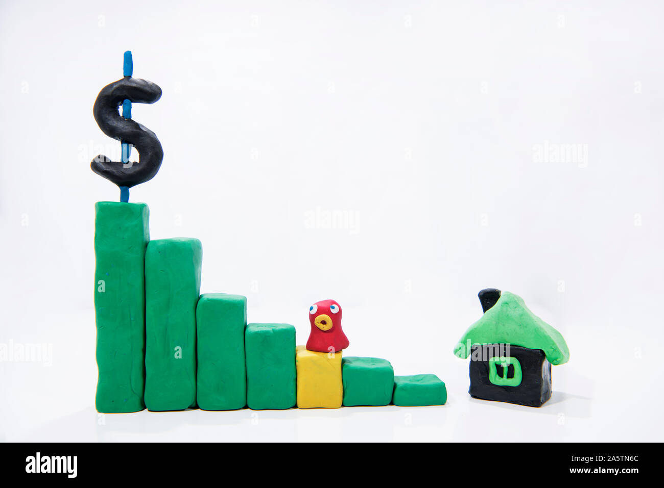Abstrakte Foto kaufen / verkaufen. Haus aus Spielen Ton mit grünen Graph. Stockfoto