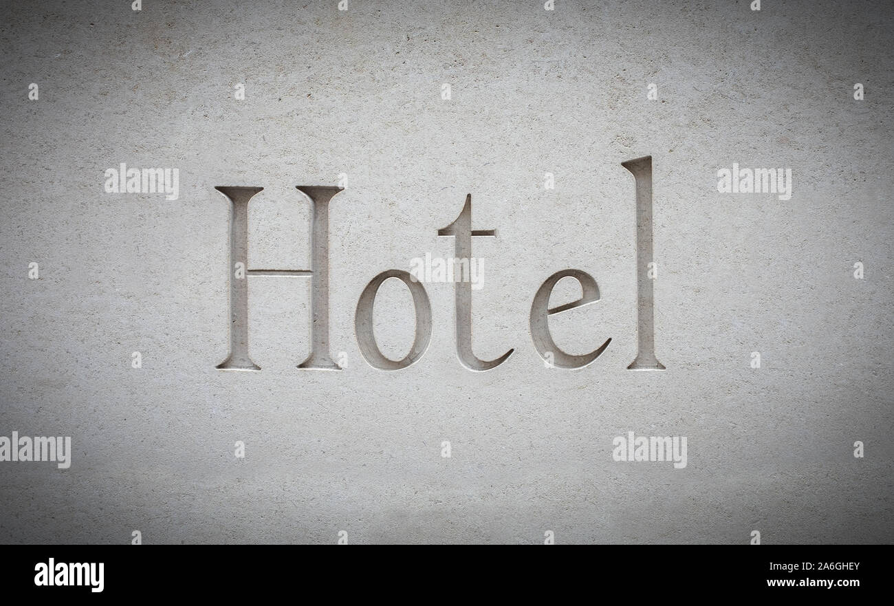 Ein Zeichen für ein luxuriöses und modernes Hotel in Stein graviert Stockfoto