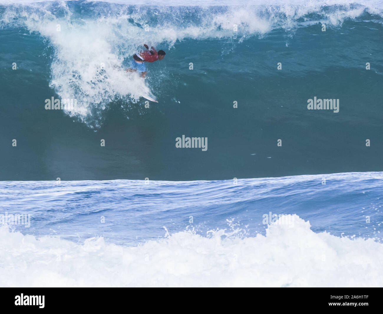 Surfer, eine Fahrt mit der U-Bahn an der Pipeline, Hawaii Stockfoto