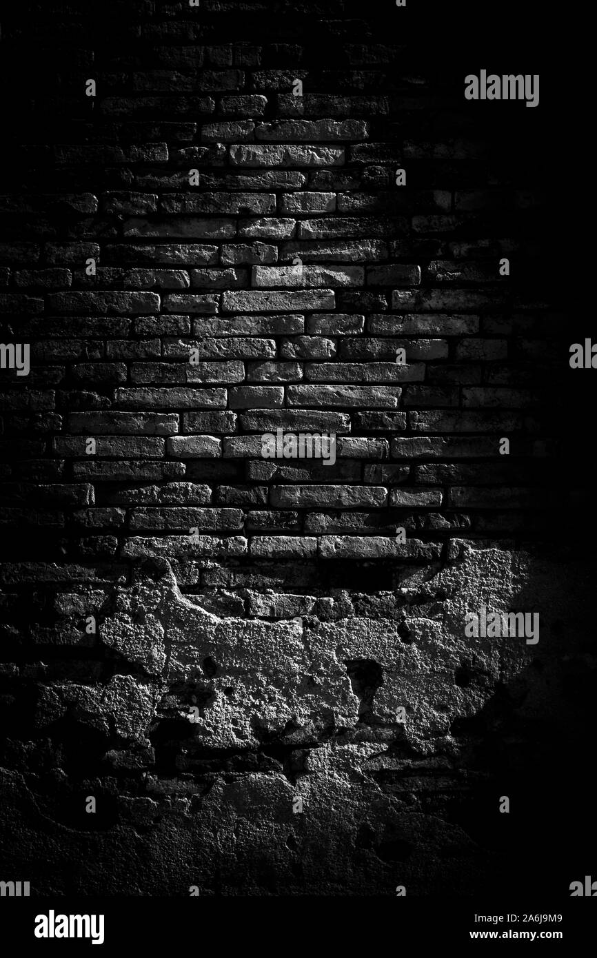 Schwarze Mauerwerk Hintergrund und Textur. Die Textur der Ziegel ist Schwarz. Hintergrund der leeren brick Kellerwand. schwarze Wand. Stockfoto