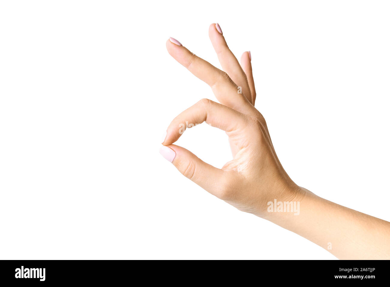 Schöne weibliche Hand gestikulierend. Okay Symbol. Auf weissem Hintergrund. Stockfoto